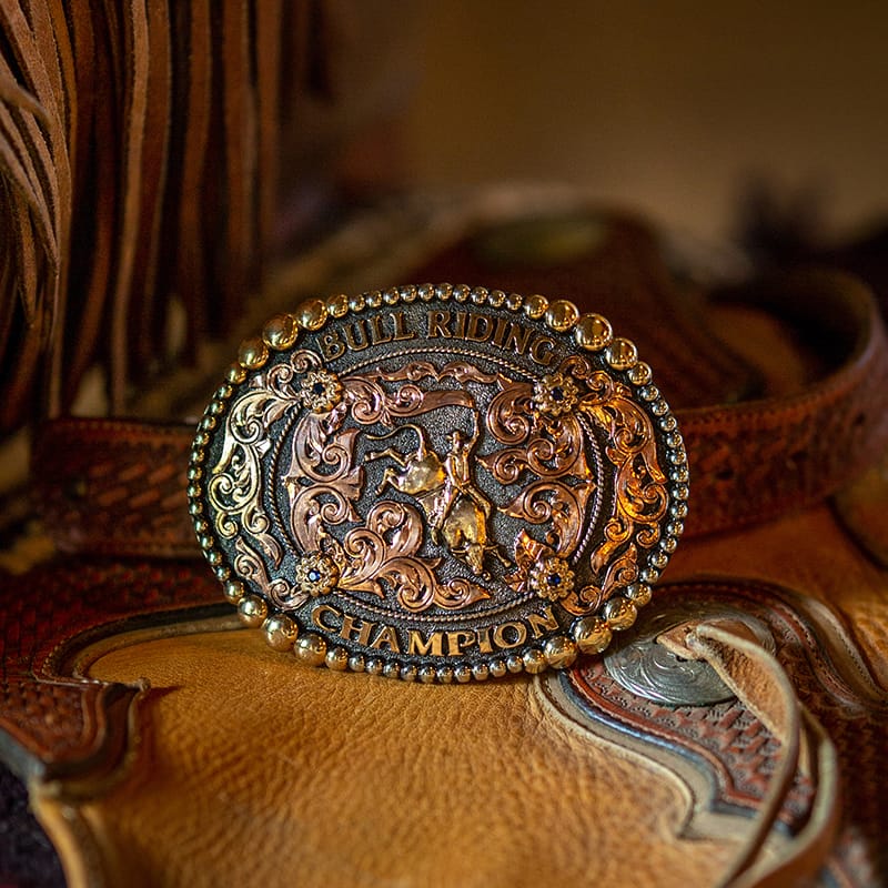 A bull riding rodeo belt buckle